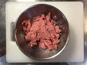 Fully mixed ground beef and binder ready for an open-faced Swedish burger.